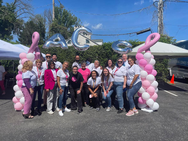 Group photo with pink and white balloons